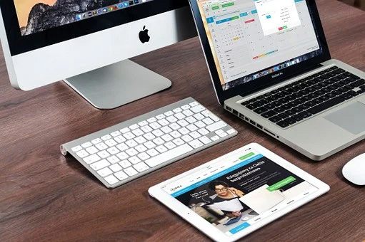 Table top with Apple Mac and iPads